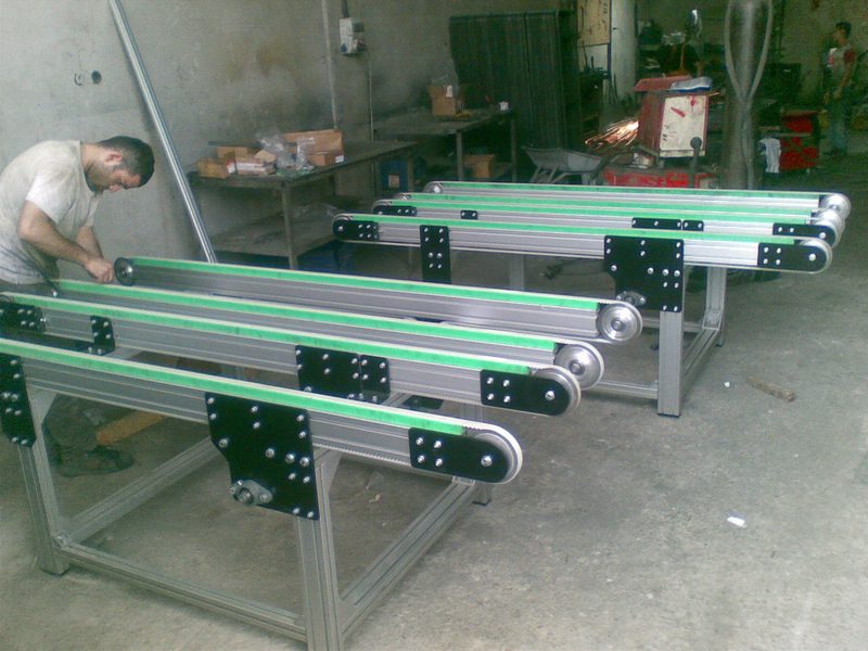 Mounting frame for conveyor technology with roller track and drive mounts