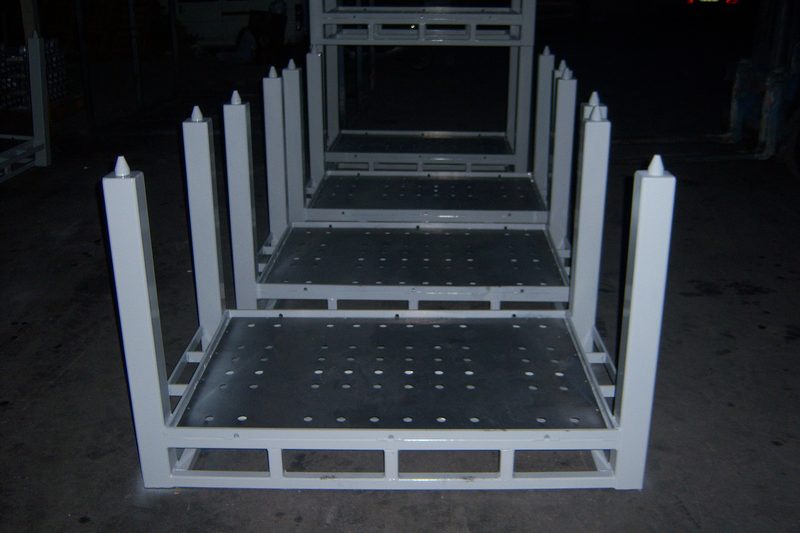 Row of stackable transport racks with perforated loading floor